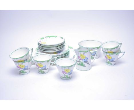 An Art Deco Heathcote China ‘The Lea’ tea service, with colourful yellow, blue and pink flower head decoration and green bord