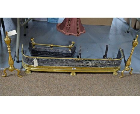 A Victorian brass and pierced steel fender, 101 x 23 x 19cms high; a pair of brass and steel urn-pattern andirons, 46cms high