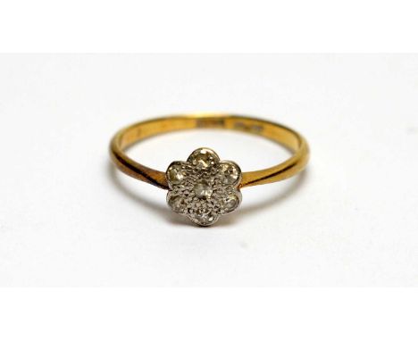 A diamond cluster ring, in platinum mount and 18ct yellow gold shank, ring size M, 1.8g gross 