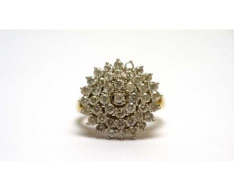 A diamond cluster ring, of target form with four-tiers, in 18ct white gold mount and yellow gold shank, ring size R, 7.7g gro
