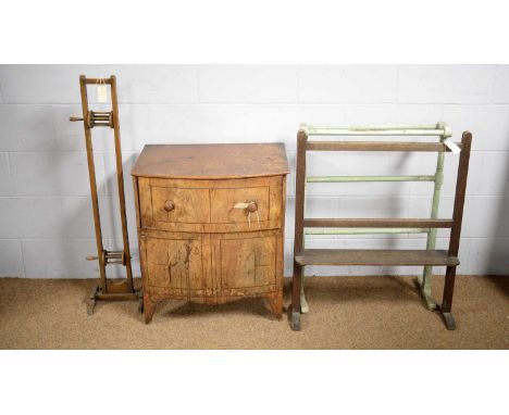 An early 20th Century oak wool winder; two vintage towel rails; and a Georgian mahogany bowfront commode. (4)