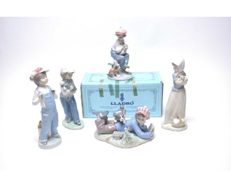 A Lladro figure of ‘Golfer with Dog’, with box; together with two other Lladro figures and two Nao figures. (5)