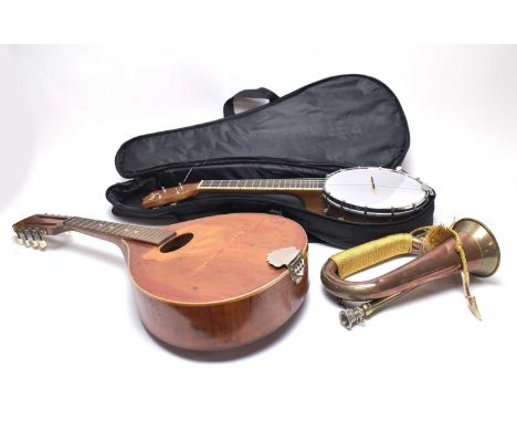 An Irin banjolele, in soft carry case; together with a Dutch Egmond mandolin; and a copper and brass bugle. (3)  