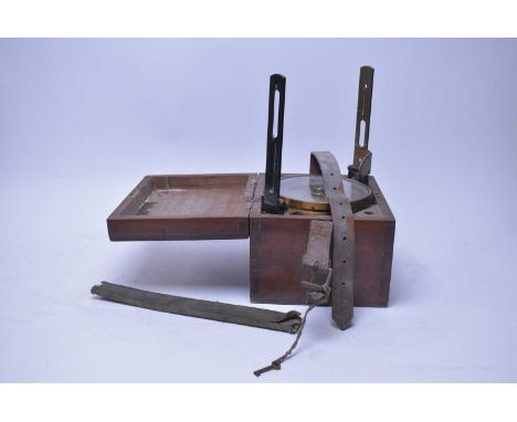 An early 20th Century black lacquered brass surveyors' level, in mahogany carry case, with repair label relating to Alex Mabo