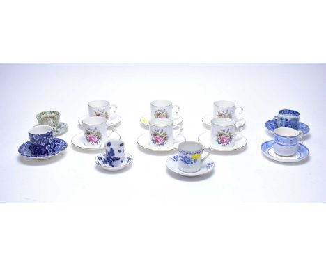 A set of six Royal Worcester coffee cups and saucers, with floral decoration; together with other coffee cups and saucers, in