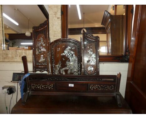 A Chinese hardwood and mother of pearl inlaid fire screen 