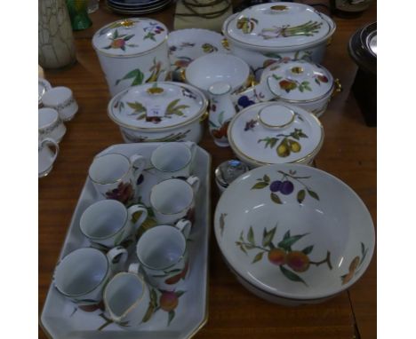 A quantity of Royal Worcester Evesham pattern tablewares, comprising various covered serving dishes, mugs, biscuit barrel, sa