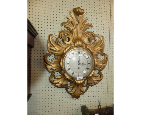 A Continental wall clock in gilt Florentine type frame 