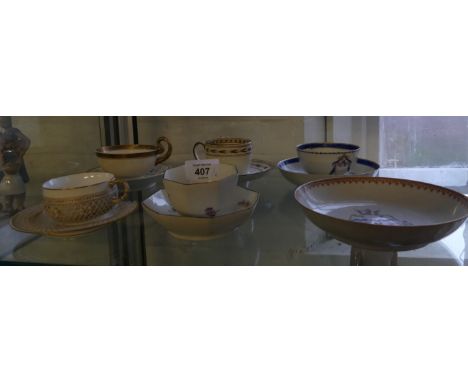 A mixed lot comprising 19th Century Wedgwood teacup and saucer, Armorial tea bowls and saucers, Sevres cup and saucer with la
