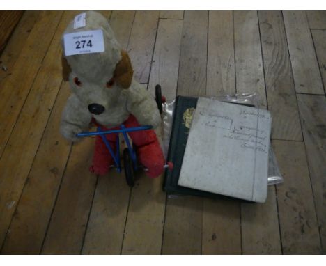 A Vintage child's toy dog on a bike together with a  crest and monogram album together with a further Vellum conveyancing doc