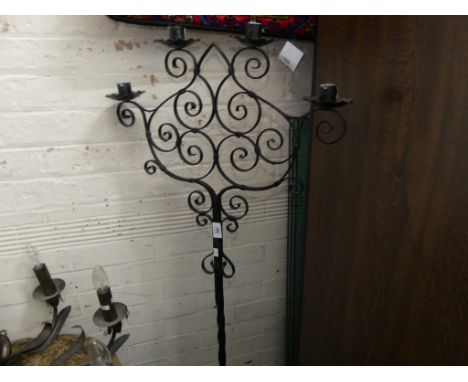 A floor standing iron candelabra 
