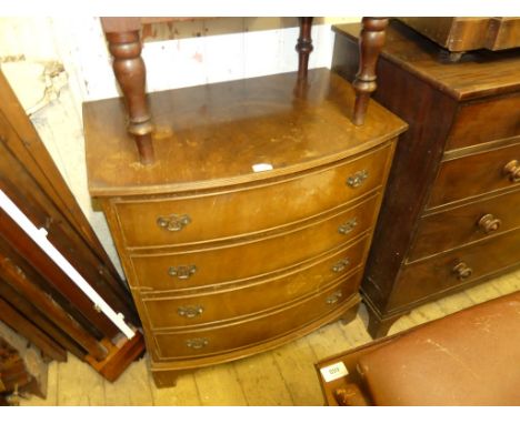 A reproduction mahogany bow front chest of four drawers raised on bracket feet. 