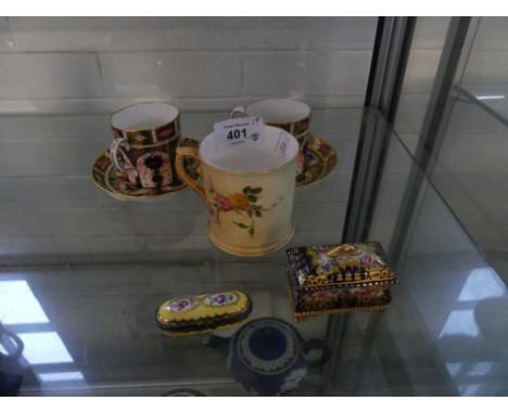 A mixed lot comprising two Crown Derby coffee cans and saucers, pattern 1128, together with a further blush Worcester coffee 