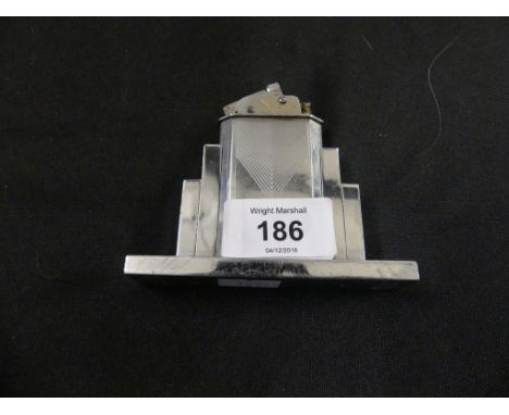 A French Art Deco chrome finish table lighter Of stepped form, marked to base Myon 401, height 7.5cm 