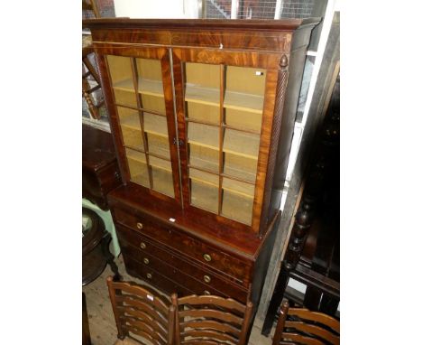 A George III mahogany secretaire bookcase cabinetThe top section with moulded cornice with brass inlay, over two glazed doors