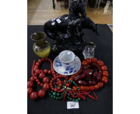 A carved hardstone group of three horses on a rocky plinth base together with a malachite bead necklace with one other and th