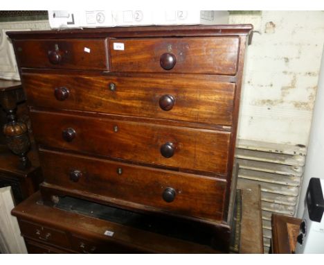A Georgian mahogany chest of two short and three long drawers raised on bracket feet 