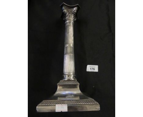A large 19th Century silver-plated candlestick formed as a Corinthian column raised on a square loaded base. 