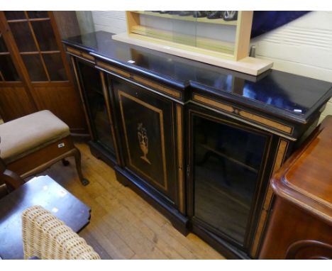 A Victorian walnut and ebonised breakfront bookcase cabinet, in the aesthetic styleWith two glazed side doors and a central s