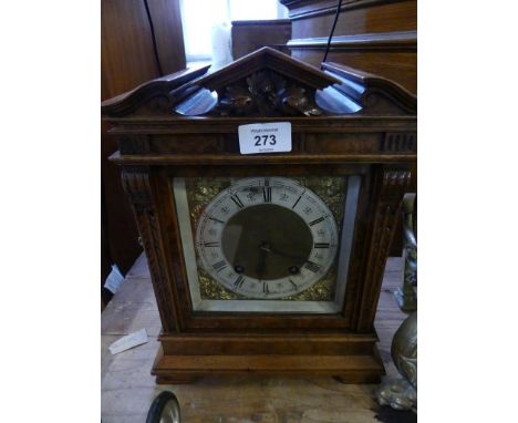 Lenzkirch, a 20th Century mantel clock, with brass movement striking on two coils set into a burr walnut veneered case of arc