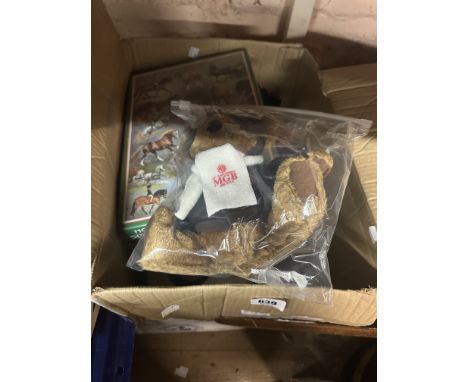 A box containing a quantity of mixed items including a Mickey Mouse hand puppet, an MGB souvenir Teddy bear, horse breeds jig