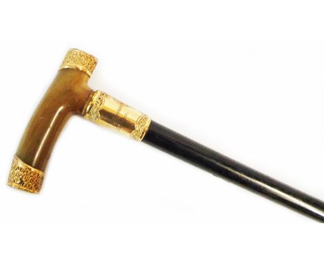 A 92cm horn handled walking stick with ornate embossed yellow metal mounts, personalised inscription to cartouche and tapered