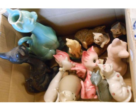 A box containing a quantity of ceramic cat figurines