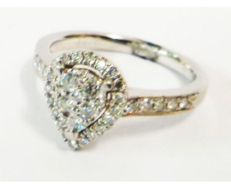 A marked 950PT white metal diamond cluster ring with pear drop shaped panel and further tiny diamonds to shoulders - size K 1