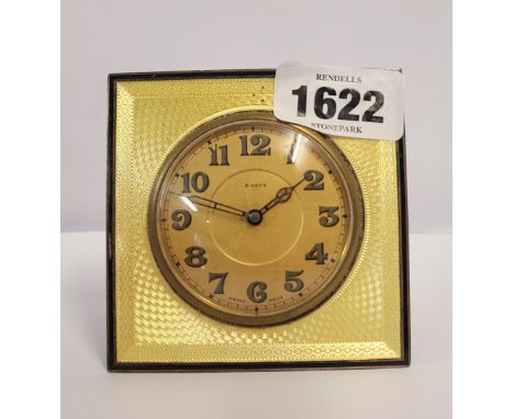 An antique silver dressing table timepiece with yellow enamelled engine turned front and easel back - overwound - Birmingham 