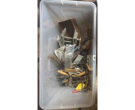 A crate containing a quantity of assorted tools