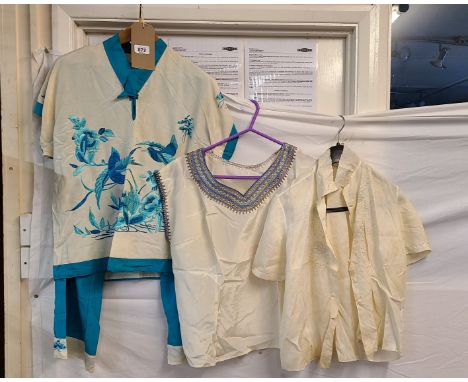 A pair of Chinese style polycotton pyjamas with blue and turquoise machine embroidered decoration, depicting birds amongst fo