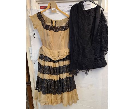 A mid 20th Century light brown chiffon cocktail dress with black lace to neckline and skirt - sold with black satin skirt and