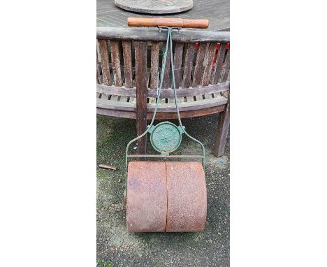 A vintage garden roller stamped 'The Gordon, Timothy Whites'