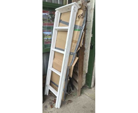 A boxed painted wood folding shelf display unit