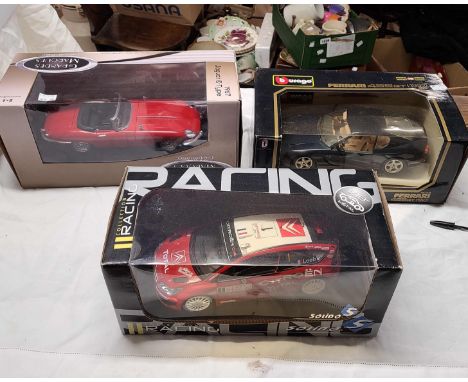 Three large boxed die cast cars comprising a Ferrari G56TE, a Solido Citroen C 4 WRC in racing colours and a Grandes Marques 