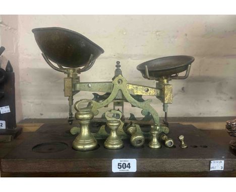 An old set of scales with part set of weights