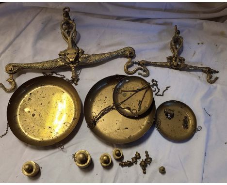 A set of decorative brass scales with weights