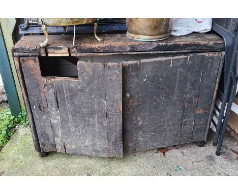 An old wooden work bench cabinet