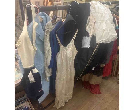 A small quantity of vintage fashion comprising two early 20th Century satin nightdresses, blue dress, a Gileric Gowns dark bl