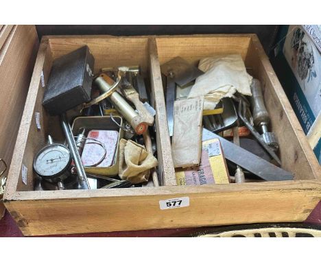 A wooden tray containing watch maker's tools and accessories, etc.
