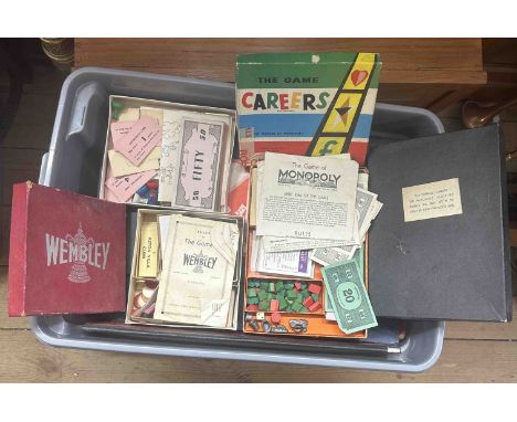A crate containing a quantity of vintage and other board games including Monopoly, Wembley, Oscar, etc.