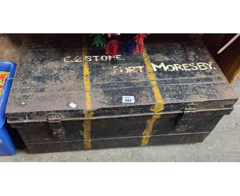 An old tin trunk with black japanned finish