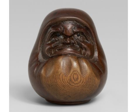   Daruma-Puppe. Eibe. Hida. Um 1900  Sign.: SukeyukiDer Zen-Patriarch, auf einer kreisrunden Plinthe sitzend und komplett in 