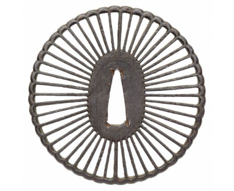   Tsuba. Eisen. 17./18. Jh.  Oval. 48-fach gebogt in der Art einer stilisierten Chrysanthemenblüte in durchbrochenem Relief.H