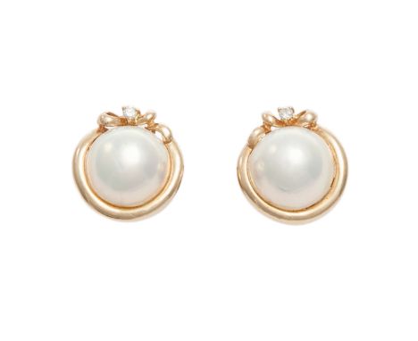 A pair of diamond and mabé pearl earrings, each composed of a single mabé pearl to centre, approx. 14mm diameter, to a polish