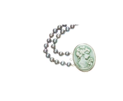 A cultured pearl necklace, composed of two rows of grey cultured pearls measuring approx. 8mm to a moulded oval cameo of a la