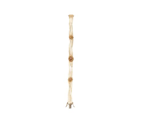 A 14 carat gold bracelet, composed of textured interwoven strands centred by a rossete motif with a circular-cut ruby highlig