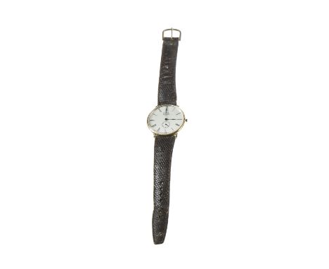 An 18 carat gold openface pocket watch circa 1900, the plain white ceramic dial with black Roman numerals within a plain poli