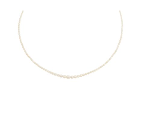 A natural pearl necklace, composed of graduated pearls measuring 1mm - 5mm, to a barrel-shaped clasp set with rose-cut diamon