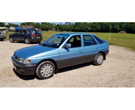 A 1993 Ford Escort 1.6i LX 16vRegistration number K915 XPMMetallic light blueUnder 38,300 milesOne recorded owner from newTim